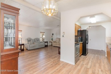 Own this home in the resort like community of Barefoot Bay on Barefoot Bay Golf Course in Florida - for sale on GolfHomes.com, golf home, golf lot