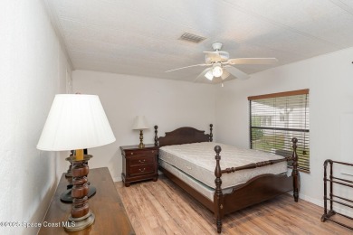 Own this home in the resort like community of Barefoot Bay on Barefoot Bay Golf Course in Florida - for sale on GolfHomes.com, golf home, golf lot
