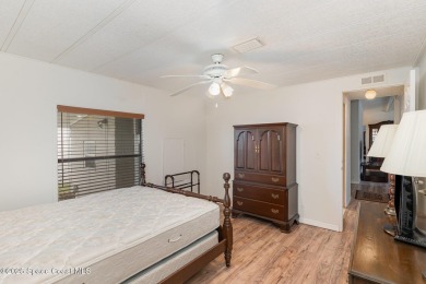 Own this home in the resort like community of Barefoot Bay on Barefoot Bay Golf Course in Florida - for sale on GolfHomes.com, golf home, golf lot