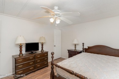 Own this home in the resort like community of Barefoot Bay on Barefoot Bay Golf Course in Florida - for sale on GolfHomes.com, golf home, golf lot