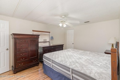 Own this home in the resort like community of Barefoot Bay on Barefoot Bay Golf Course in Florida - for sale on GolfHomes.com, golf home, golf lot