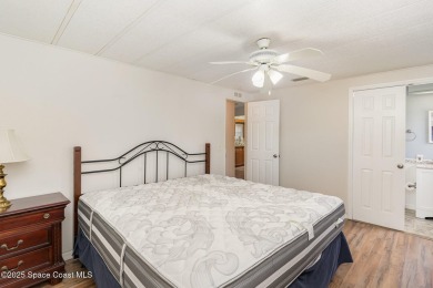 Own this home in the resort like community of Barefoot Bay on Barefoot Bay Golf Course in Florida - for sale on GolfHomes.com, golf home, golf lot