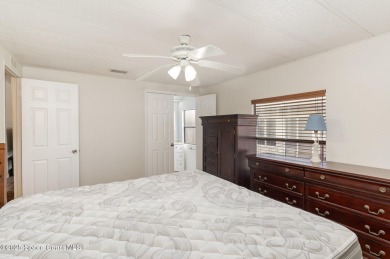 Own this home in the resort like community of Barefoot Bay on Barefoot Bay Golf Course in Florida - for sale on GolfHomes.com, golf home, golf lot
