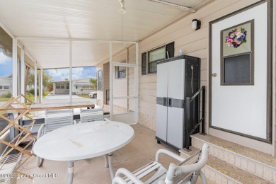 Own this home in the resort like community of Barefoot Bay on Barefoot Bay Golf Course in Florida - for sale on GolfHomes.com, golf home, golf lot