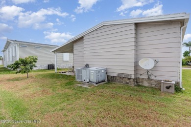 Own this home in the resort like community of Barefoot Bay on Barefoot Bay Golf Course in Florida - for sale on GolfHomes.com, golf home, golf lot