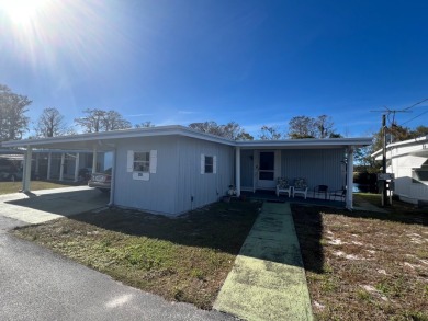 Fabulous 2-bedroom 2 bath home in an active community in on Bay Tree Golf Course in Florida - for sale on GolfHomes.com, golf home, golf lot