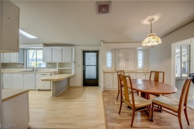 Remodeled with a new roof, new garage for golf cart, and a on Lake Fairways Country Club in Florida - for sale on GolfHomes.com, golf home, golf lot