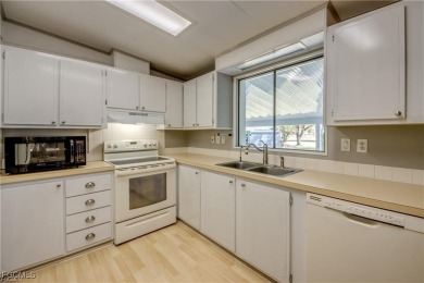Remodeled with a new roof, new garage for golf cart, and a on Lake Fairways Country Club in Florida - for sale on GolfHomes.com, golf home, golf lot