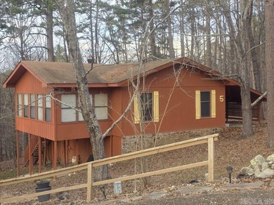 Nestled in the quiet, wooded Cartagena neighborhood of Hot on DeSoto Golf Course in Arkansas - for sale on GolfHomes.com, golf home, golf lot