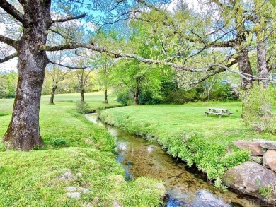 Between two North Carolina mountain ridges lies an expansive on Headwaters Golf Club in North Carolina - for sale on GolfHomes.com, golf home, golf lot