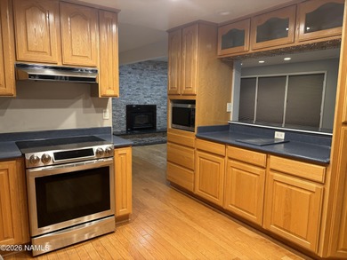 Fantastic golf course location home. Cedar siding and rock on Continental Country Club in Arizona - for sale on GolfHomes.com, golf home, golf lot