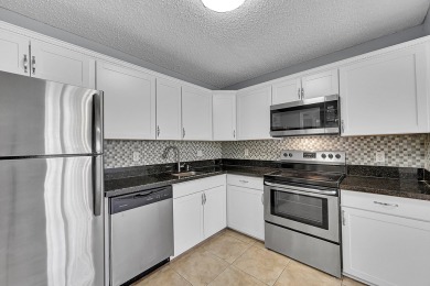 ALL AGES condo blends style & function! Spacious bedroom on Inverrary Country Club in Florida - for sale on GolfHomes.com, golf home, golf lot
