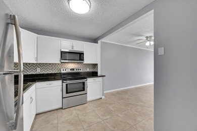 ALL AGES condo blends style & function! Spacious bedroom on Inverrary Country Club in Florida - for sale on GolfHomes.com, golf home, golf lot