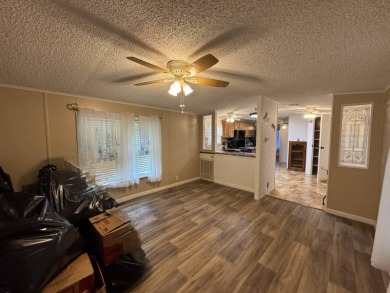 This immaculate, well-maintained 2 bedroom/2 bath manufactured on Lake Henry Golf Club in Florida - for sale on GolfHomes.com, golf home, golf lot
