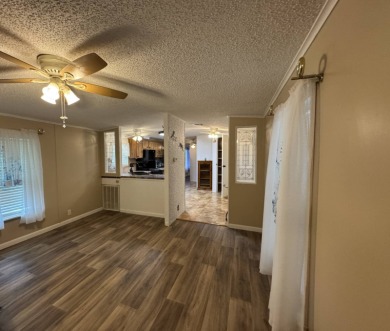 This immaculate, well-maintained 2 bedroom/2 bath manufactured on Lake Henry Golf Club in Florida - for sale on GolfHomes.com, golf home, golf lot