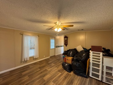 This immaculate, well-maintained 2 bedroom/2 bath manufactured on Lake Henry Golf Club in Florida - for sale on GolfHomes.com, golf home, golf lot