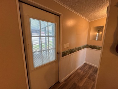 This immaculate, well-maintained 2 bedroom/2 bath manufactured on Lake Henry Golf Club in Florida - for sale on GolfHomes.com, golf home, golf lot