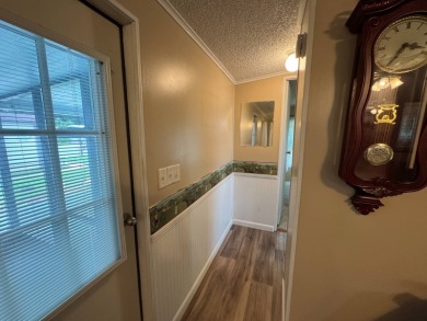 This immaculate, well-maintained 2 bedroom/2 bath manufactured on Lake Henry Golf Club in Florida - for sale on GolfHomes.com, golf home, golf lot