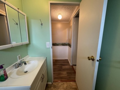 This immaculate, well-maintained 2 bedroom/2 bath manufactured on Lake Henry Golf Club in Florida - for sale on GolfHomes.com, golf home, golf lot