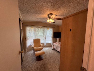 This immaculate, well-maintained 2 bedroom/2 bath manufactured on Lake Henry Golf Club in Florida - for sale on GolfHomes.com, golf home, golf lot