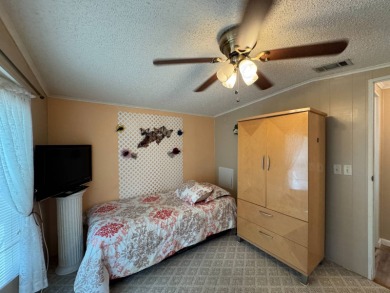 This immaculate, well-maintained 2 bedroom/2 bath manufactured on Lake Henry Golf Club in Florida - for sale on GolfHomes.com, golf home, golf lot