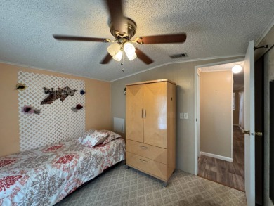 This immaculate, well-maintained 2 bedroom/2 bath manufactured on Lake Henry Golf Club in Florida - for sale on GolfHomes.com, golf home, golf lot