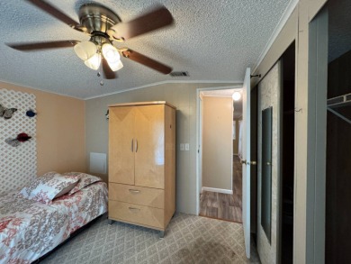 This immaculate, well-maintained 2 bedroom/2 bath manufactured on Lake Henry Golf Club in Florida - for sale on GolfHomes.com, golf home, golf lot