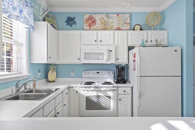 BEACH THEMED GROUND FLOOR END CORNER UNIT. THIS UNIT HAS BEEN on Barefoot Resort and Golf Club  in South Carolina - for sale on GolfHomes.com, golf home, golf lot