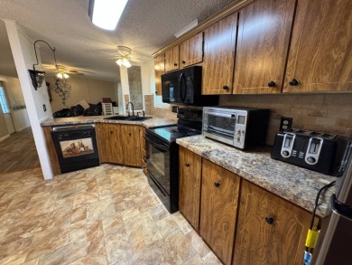 This immaculate, well-maintained 2 bedroom/2 bath manufactured on Lake Henry Golf Club in Florida - for sale on GolfHomes.com, golf home, golf lot