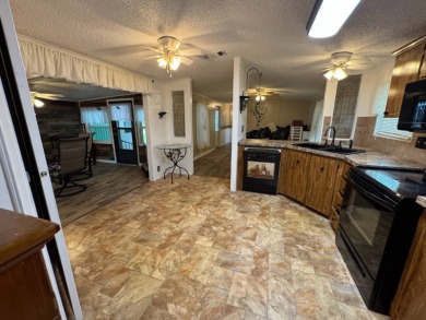This immaculate, well-maintained 2 bedroom/2 bath manufactured on Lake Henry Golf Club in Florida - for sale on GolfHomes.com, golf home, golf lot