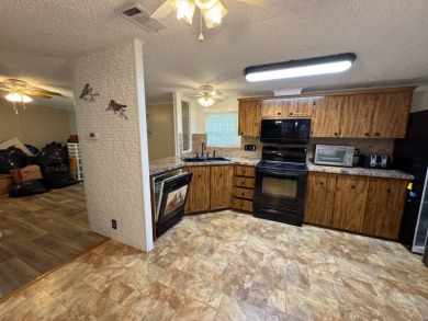 This immaculate, well-maintained 2 bedroom/2 bath manufactured on Lake Henry Golf Club in Florida - for sale on GolfHomes.com, golf home, golf lot