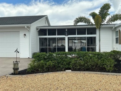 This home truly has it all! Attached RV port built to on Lily Lake Golf and RV Resort in Florida - for sale on GolfHomes.com, golf home, golf lot