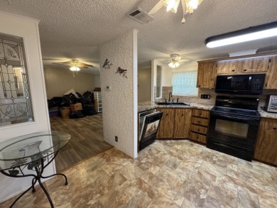 This immaculate, well-maintained 2 bedroom/2 bath manufactured on Lake Henry Golf Club in Florida - for sale on GolfHomes.com, golf home, golf lot