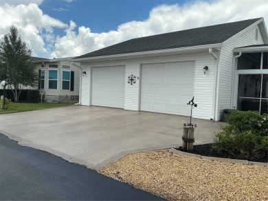 This home truly has it all! Attached RV port built to on Lily Lake Golf and RV Resort in Florida - for sale on GolfHomes.com, golf home, golf lot