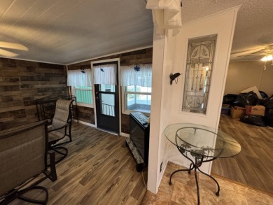 This immaculate, well-maintained 2 bedroom/2 bath manufactured on Lake Henry Golf Club in Florida - for sale on GolfHomes.com, golf home, golf lot