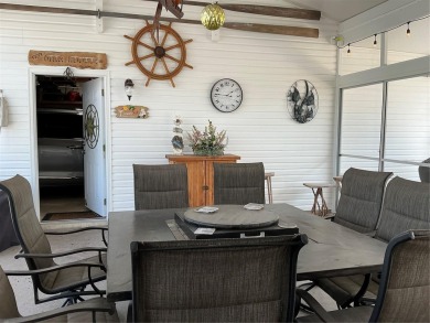 This home truly has it all! Attached RV port built to on Lily Lake Golf and RV Resort in Florida - for sale on GolfHomes.com, golf home, golf lot