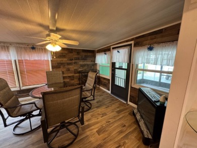 This immaculate, well-maintained 2 bedroom/2 bath manufactured on Lake Henry Golf Club in Florida - for sale on GolfHomes.com, golf home, golf lot