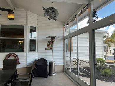 This home truly has it all! Attached RV port built to on Lily Lake Golf and RV Resort in Florida - for sale on GolfHomes.com, golf home, golf lot