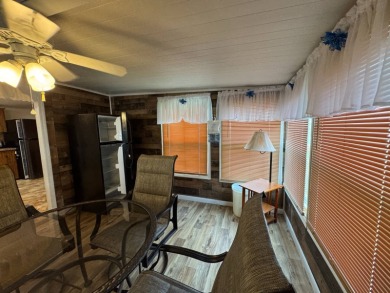 This immaculate, well-maintained 2 bedroom/2 bath manufactured on Lake Henry Golf Club in Florida - for sale on GolfHomes.com, golf home, golf lot