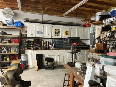 This home truly has it all! Attached RV port built to on Lily Lake Golf and RV Resort in Florida - for sale on GolfHomes.com, golf home, golf lot