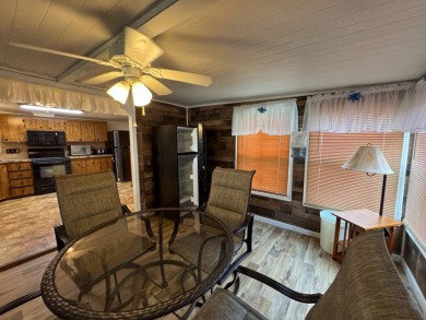 This immaculate, well-maintained 2 bedroom/2 bath manufactured on Lake Henry Golf Club in Florida - for sale on GolfHomes.com, golf home, golf lot