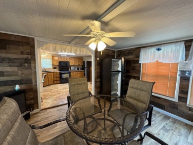 This immaculate, well-maintained 2 bedroom/2 bath manufactured on Lake Henry Golf Club in Florida - for sale on GolfHomes.com, golf home, golf lot