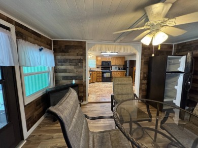 This immaculate, well-maintained 2 bedroom/2 bath manufactured on Lake Henry Golf Club in Florida - for sale on GolfHomes.com, golf home, golf lot