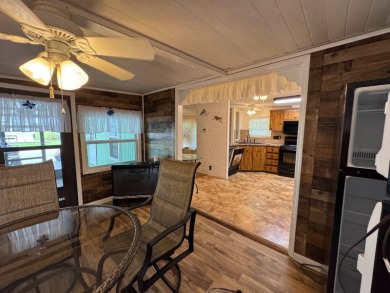 This immaculate, well-maintained 2 bedroom/2 bath manufactured on Lake Henry Golf Club in Florida - for sale on GolfHomes.com, golf home, golf lot