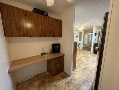 This immaculate, well-maintained 2 bedroom/2 bath manufactured on Lake Henry Golf Club in Florida - for sale on GolfHomes.com, golf home, golf lot