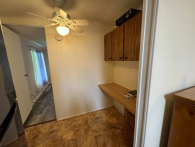 This immaculate, well-maintained 2 bedroom/2 bath manufactured on Lake Henry Golf Club in Florida - for sale on GolfHomes.com, golf home, golf lot