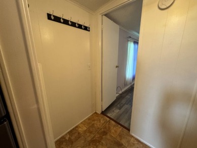 This immaculate, well-maintained 2 bedroom/2 bath manufactured on Lake Henry Golf Club in Florida - for sale on GolfHomes.com, golf home, golf lot