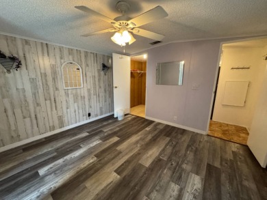 This immaculate, well-maintained 2 bedroom/2 bath manufactured on Lake Henry Golf Club in Florida - for sale on GolfHomes.com, golf home, golf lot