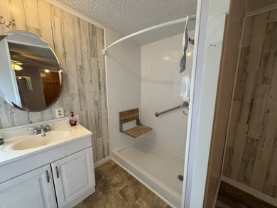 This immaculate, well-maintained 2 bedroom/2 bath manufactured on Lake Henry Golf Club in Florida - for sale on GolfHomes.com, golf home, golf lot