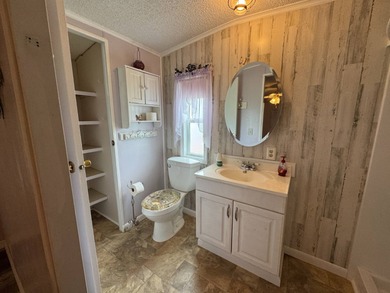 This immaculate, well-maintained 2 bedroom/2 bath manufactured on Lake Henry Golf Club in Florida - for sale on GolfHomes.com, golf home, golf lot